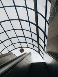 Low angle view of escalators in railroad station