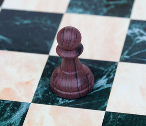 High angle view of chess pieces on floor