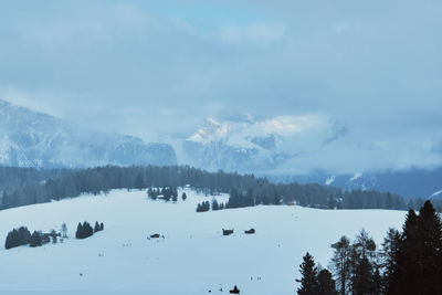 Scenic view of snow covered mountains against sky. winter hike around seceda, south tyrol, italy