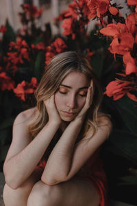 Portrait of a young woman looking down