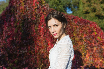Beautiful young woman in a white lace blouse in an autumn park. summer or fall lifestyle portrait 