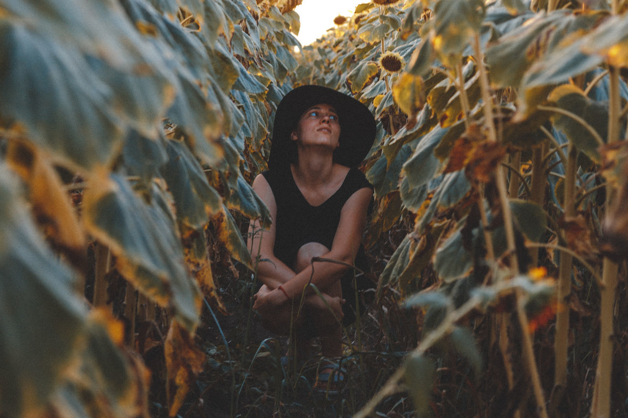 real people, front view, one person, young adult, lifestyles, field, leisure activity, young women, day, looking at camera, grass, beautiful woman, outdoors, nature, people