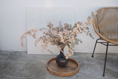 Close-up of flower vase on table at home