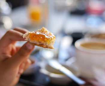 Close-up of hand holding food