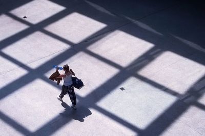 High angle view of woman shadow on bicycle