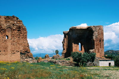 Old ruin building against blue sky