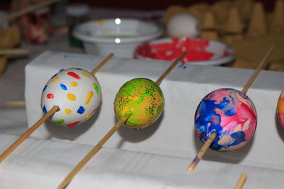 High angle view of multi colored eggs on table