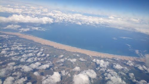 Aerial view of clouds over mountain