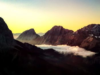 Scenic view of mountains against sky during sunset