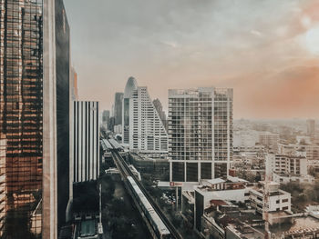Modern buildings in city against sky