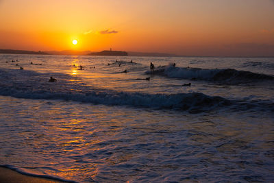 Scenic view of sea against sky during sunset