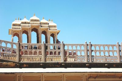 Low angle view of built structure against clear blue sky