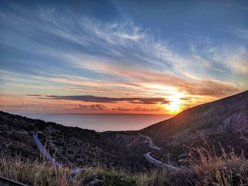 Scenic view of landscape against sky during sunset