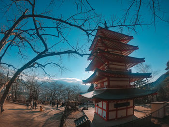 Traditional building against sky during winter