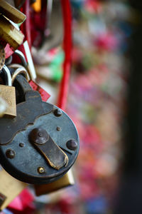 Close-up of padlocks hanging on metal