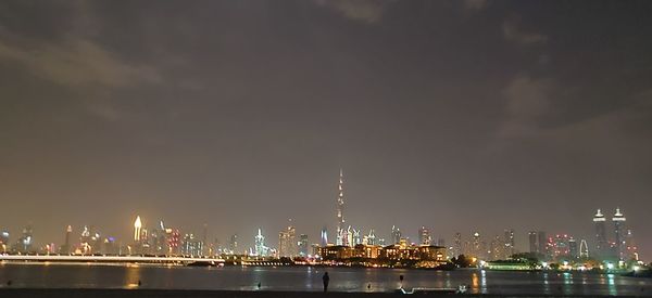 Illuminated buildings in city at night