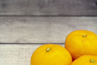 Close-up of oranges on table