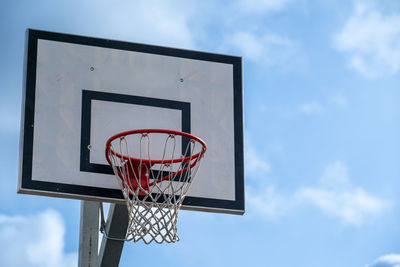 Low angle view of basketball hoop against sky