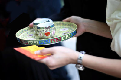 Close-up of hands on table