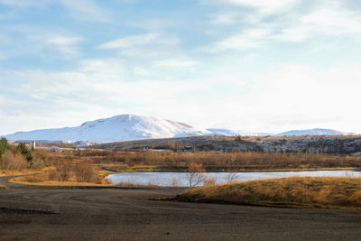 Scenic view of snowcapped mountains against sky