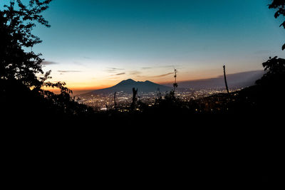 Scenic view of silhouette mountains against clear sky
