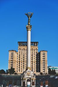 Low angle view of building against blue sky