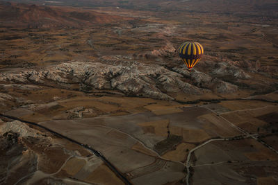 Hot air balloon flying over land