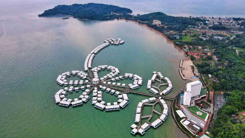 High angle view of man on sea by city