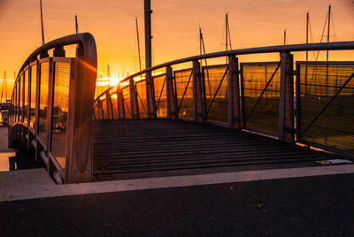 View of suspension bridge against sky during sunset