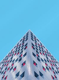 Low angle view of modern building against clear blue sky