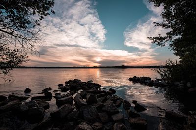 Scenic view of sea against sky at sunset