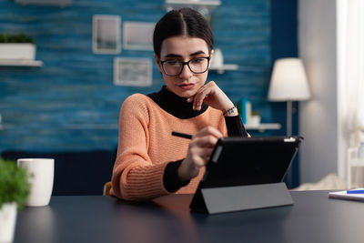 Businesswoman using digital tablet in office