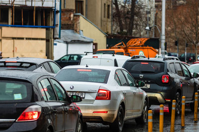 Vehicles on road along buildings