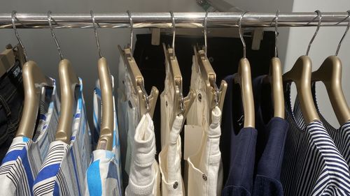 Clothes hanging in rack