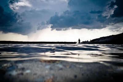 Surface level of beach against sky