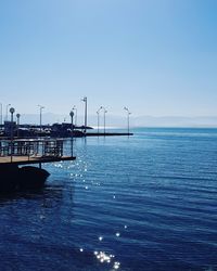 Scenic view of sea against clear blue sky