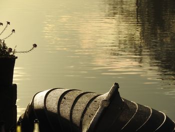 Cropped image of pipe by lake