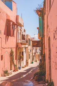 Street amidst buildings against sky