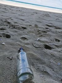 Close-up of sand on beach against sky