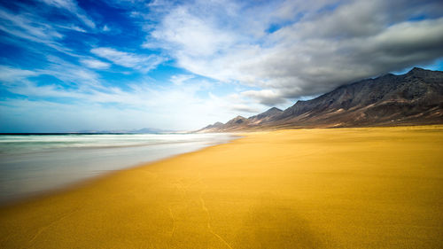 Scenic view of beach against sky