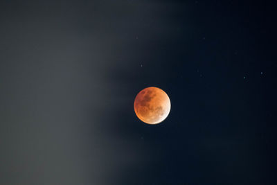 Low angle view of moon against clear sky at night