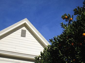 Low angle view of built structure against blue sky