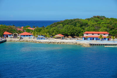 View of swimming pool by sea against sky