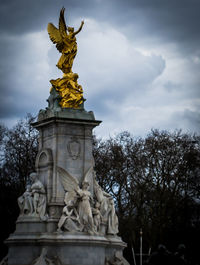 Low angle view of statue against sky