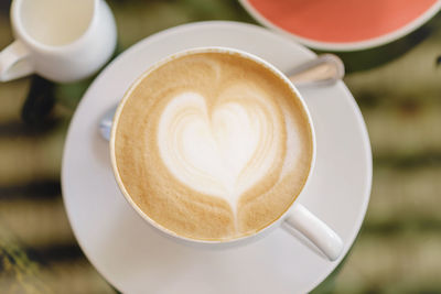 High angle view of cappuccino on table