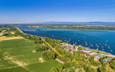 High angle view of landscape and sea against sky