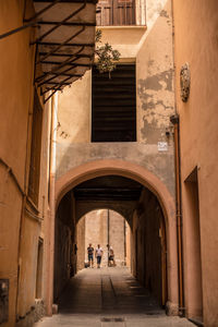 Alley amidst buildings in city