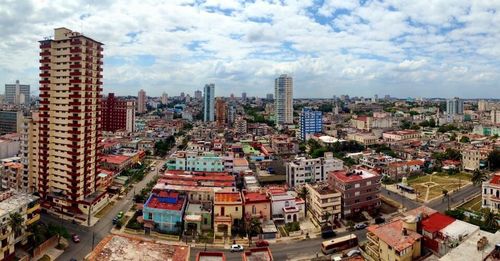 Cityscape against cloudy sky