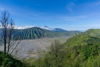 View of volcanic landscape against sky