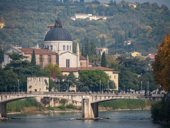 Arch bridge over river in town
